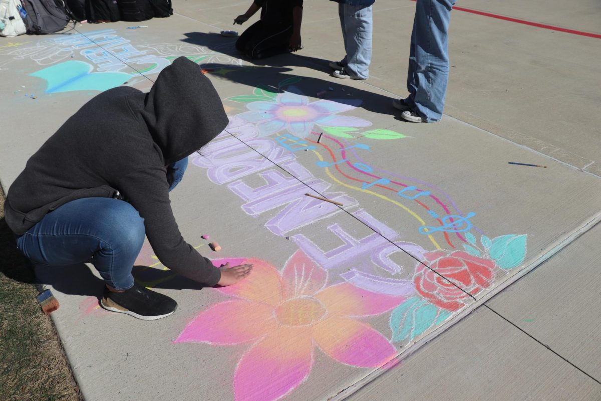 As they put the final touches on their murals, students from art classes express and articulate the significance of community membership. "It’s meant to obviously represent community and you need generosity and you need to just cherish the people around you," freshman Alexandra Rubin said. "The hand heart in our mural represents how everyone needs love for each other to actually have a community." The colors that Rubin's team used also correlate to the words, generous and cherish. 