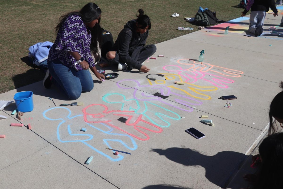 Students from different grade levels show their idea of the theme community throughout their art murals. 