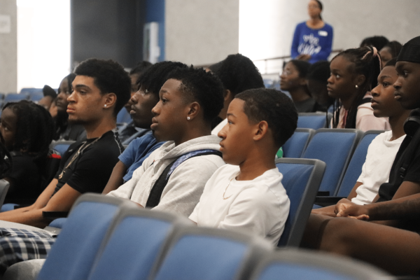 BSU student members attentively gather in the auditorium, listening to the club sponsors. “If we are to evolve as a culture, we've got to focus on unity,” co-sponsor Battles said.