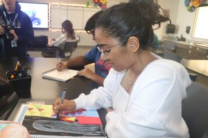 Senior Naavya Dangi works on a project in an art classroom. "When I actually got involved, I met a lot of really amazing people and really great artists," Dangi said.