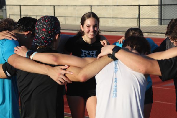 Senior Anna Williams looks at the camera during a team huddle. "It’s been a great four years," Williams said. "I’ve learned a lot, I've made great friends, but I’m ready to go on to another chapter of life."