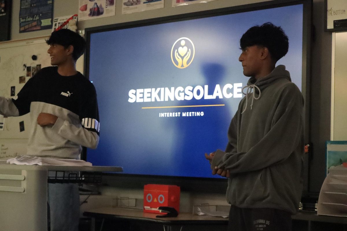 Juniors Rishab Kattimani (left) and Ranveer Jadhav (right) presenting at the interest meeting on Oct. 22.