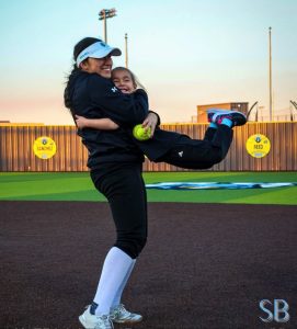 Student athlete bonding with young athlete at Rock Hill's Softball Diamond Camp.
