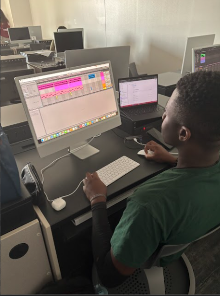 Sophomore Caleb Ablorh-Quarco is works on his project using a Digital Audio Workspace. “I think this class is unique because students get to use two different mainstream to the class,” Music Production teacher Matthew Oakes said.