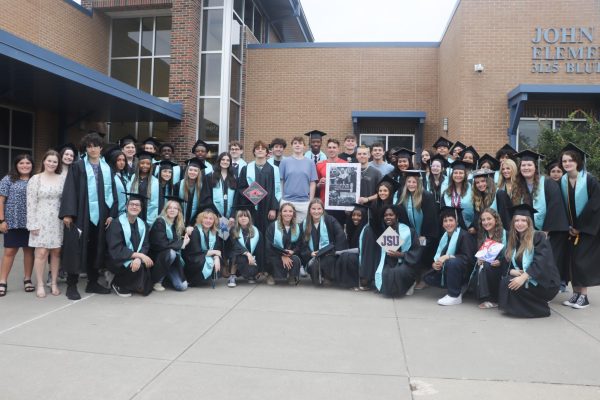 Seniors took a picture in front of their old elementary school, Baker Elementary. "It is really emotional because I remember hanging out here and all of the memories from my childhood," Megan Brooks said.