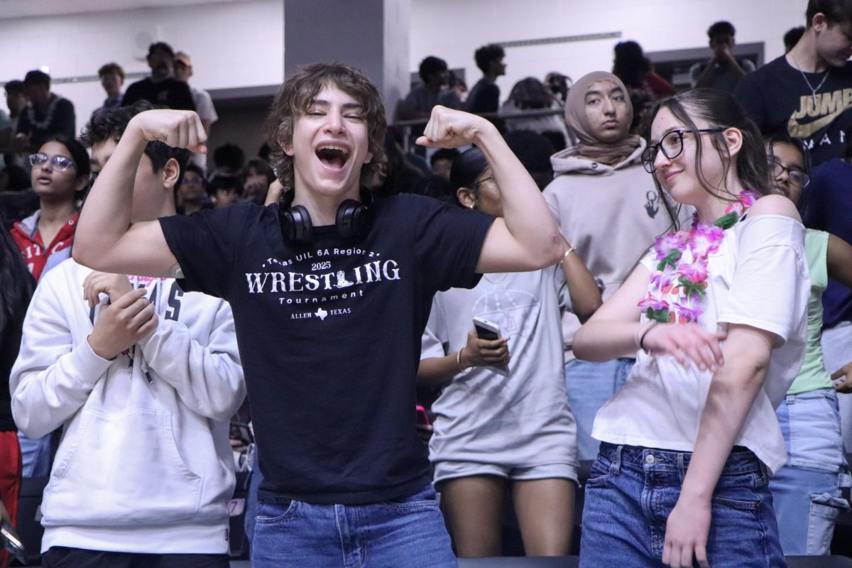 Showing school pride, Elias Cordova and Kennedy Arens-Allen participate in the competition for the spirit stick.