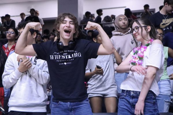 Showing school pride, Elias Cordova and Kennedy Arens-Allen participate in the competition for the spirit stick.