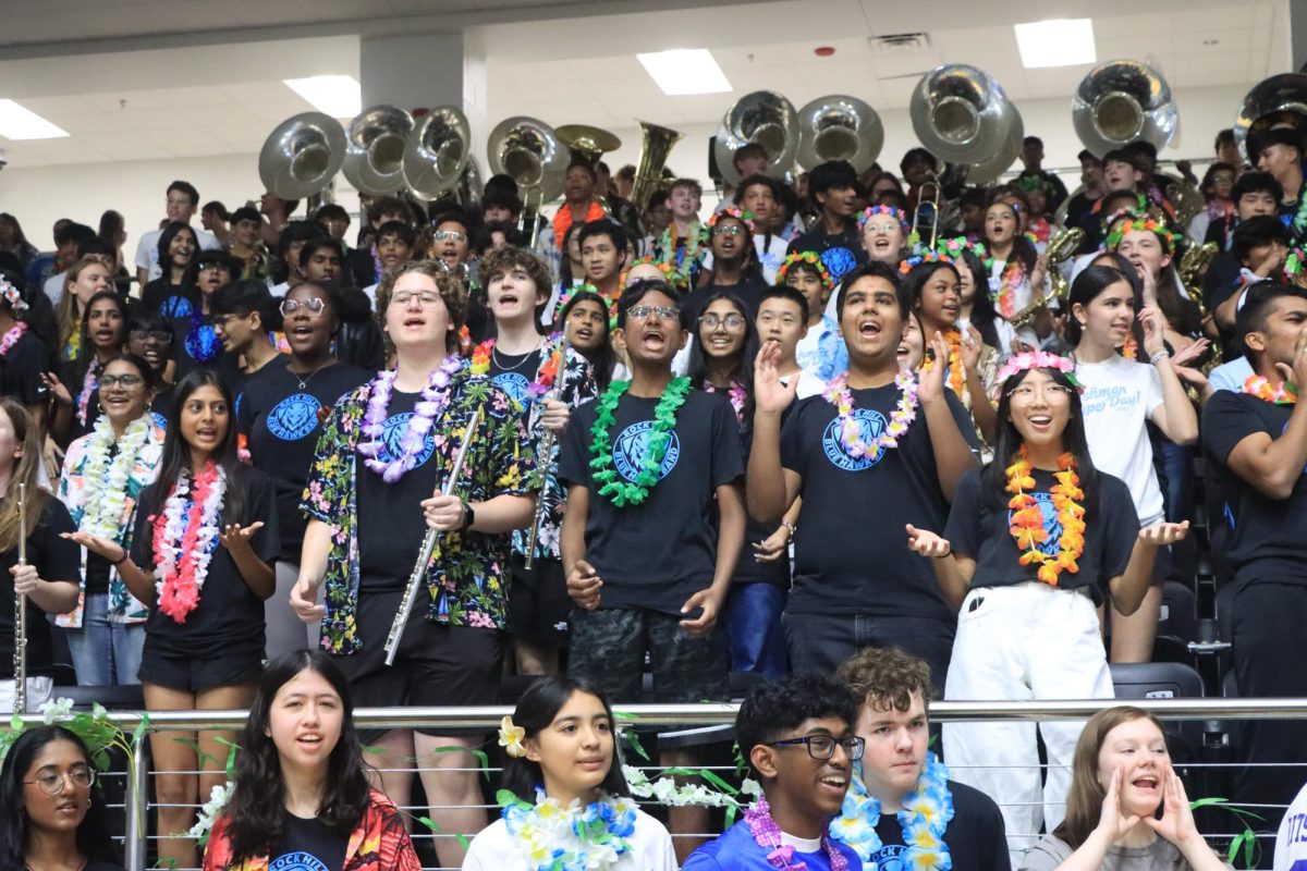 Band students from Hays and Jones Middle School join together with the Rock Hill Band to chant for fellow students performing.
