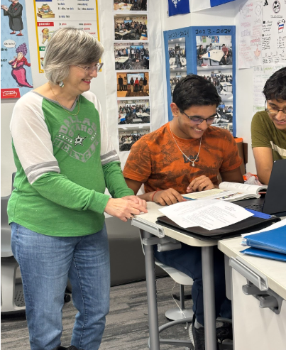  French teacher Paule Frenette shares a laugh with her students while helping them during French class. . “Most of the students are great and we need to keep helping those who want to learn ” Frenette said