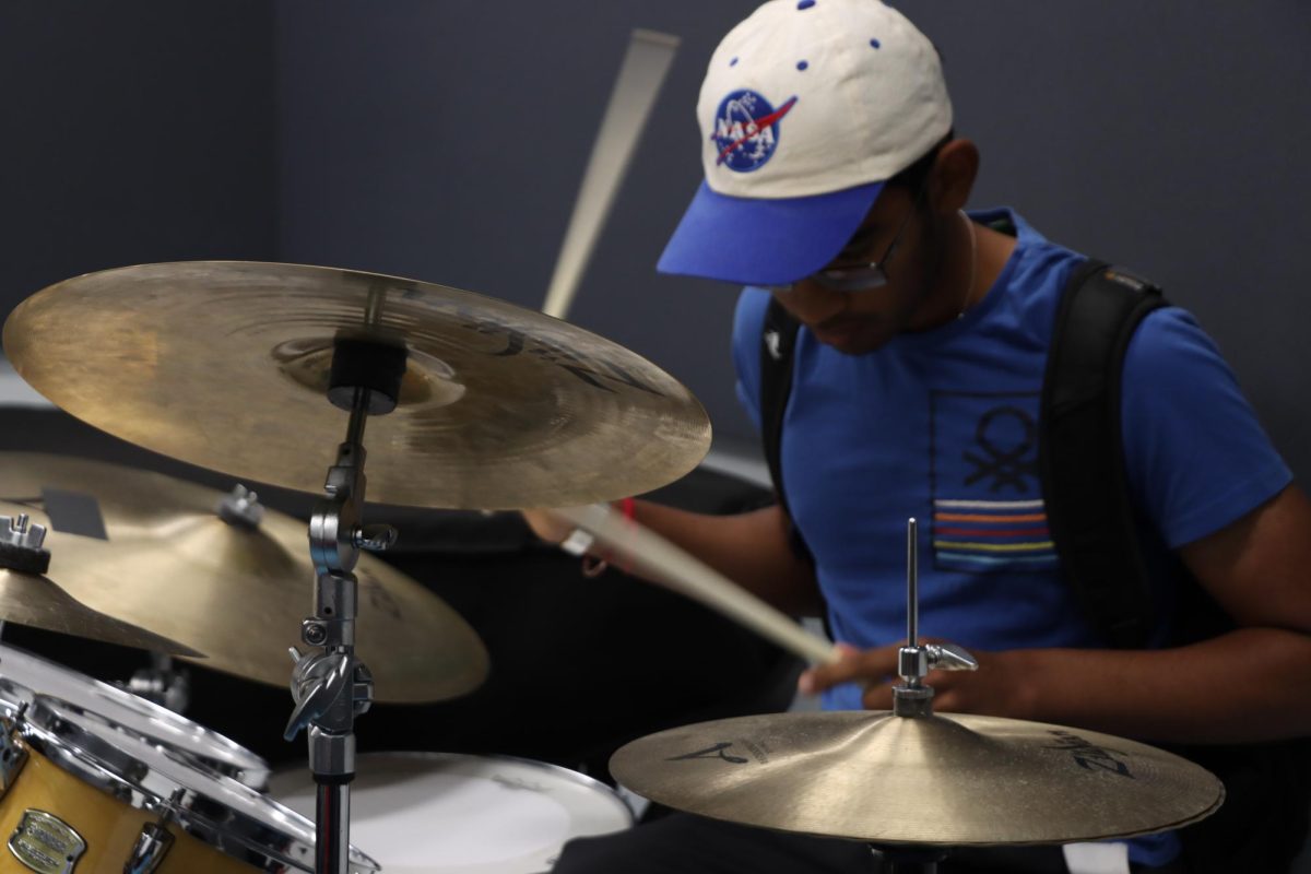 Student drumming for Red Tape's practice sessions.